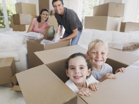 Local removals crew handling furniture carefully during a home move