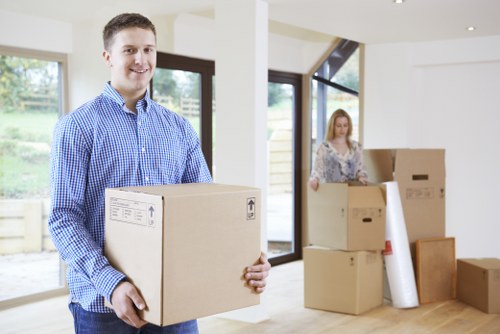 Local removals team handling boxes and furniture in Kingsbury