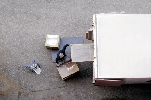 Worker checking a delivery route and handling equipment safely