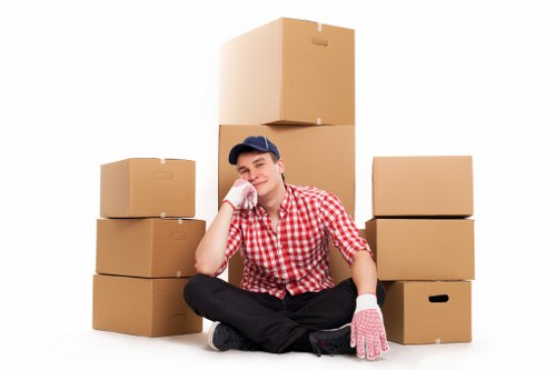 Packed moving boxes and wrapped furniture ready for house removals