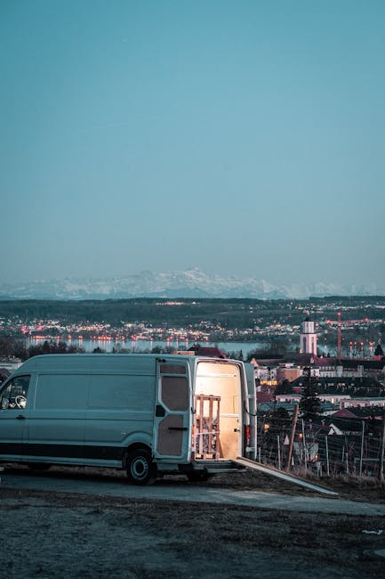 A convoy of three large trucks with blue containers, labeled Polyfoam ISO and Polyfoam XPS, are traveling along a highway in daytime with clear weather. The trucks are positioned in a single lane, wit